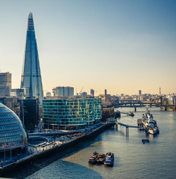 View of London City Hall and skyline at dusk