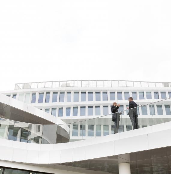 Two people stood outside a modern building