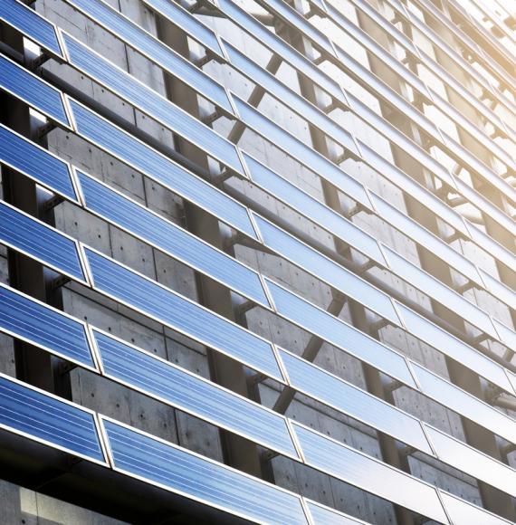 Solar panel on the side of a building on a sunny day