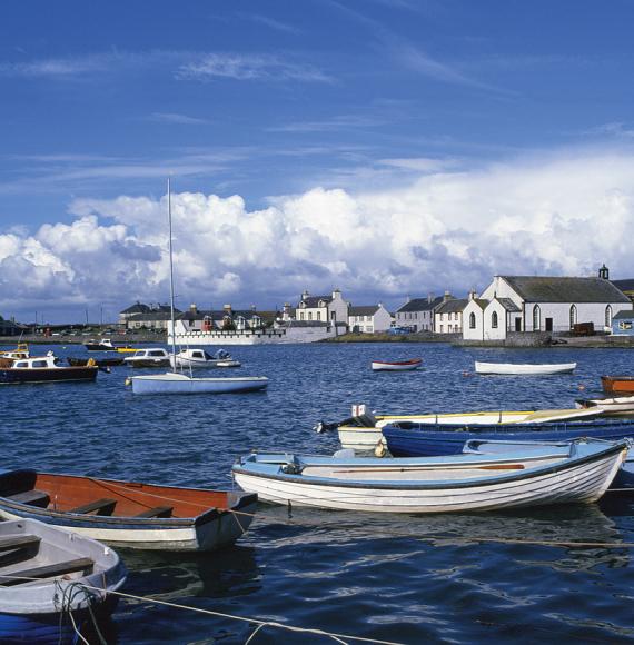 View of boats on the water at Whithorn on a sunny day