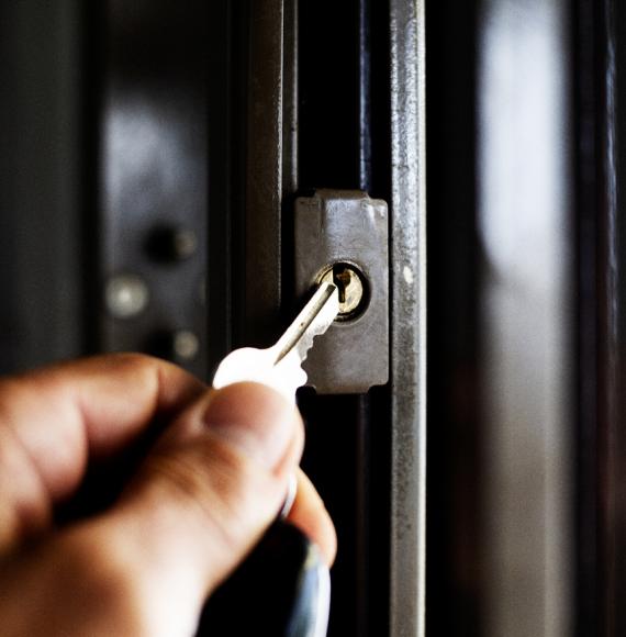 A key being put into a door