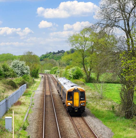 Aerial view of a train on a track in the countryside