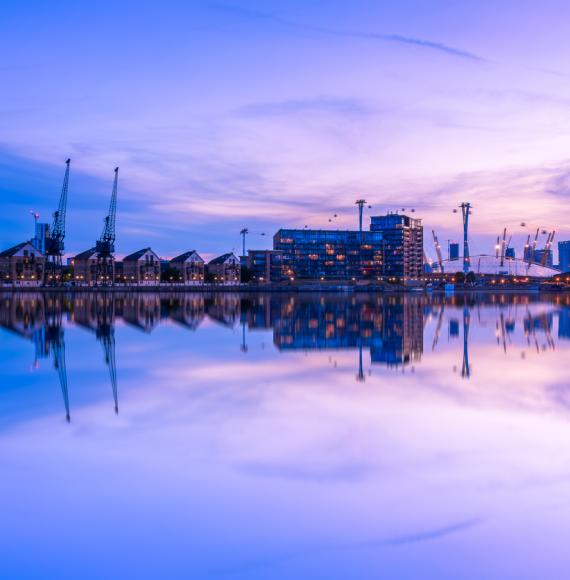 Dusk view of Royal Victoria Dock, with Canary Wharf in the background