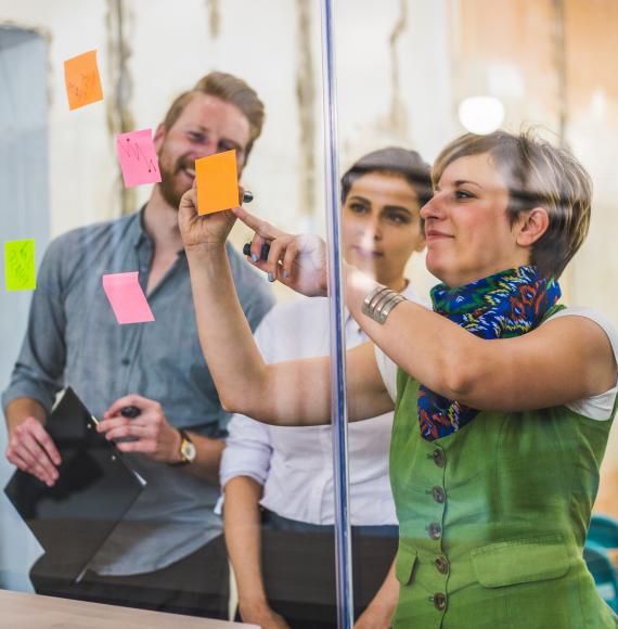 Three adults working together in an office space