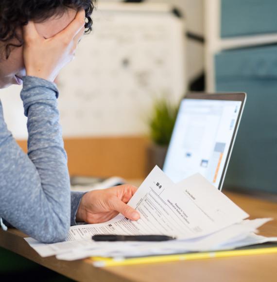 Woman looking at bills