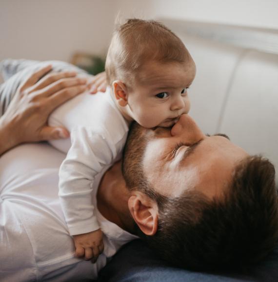 Baby playing with dad