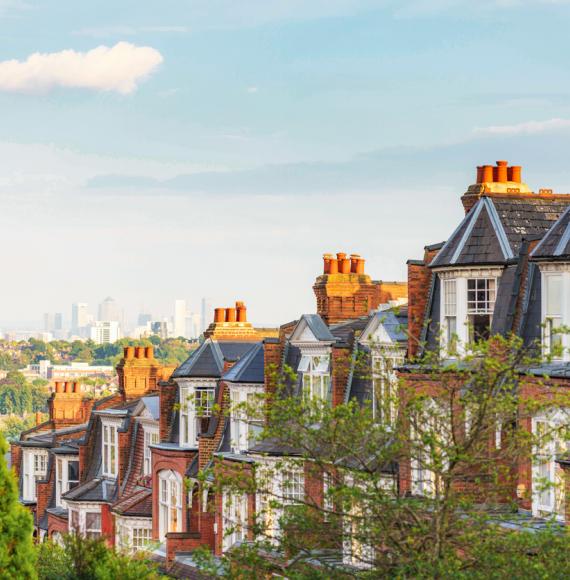View of houses in London suburb, with Canary Wharf in the background