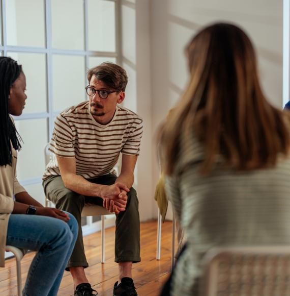 Group of people sat in a circle 