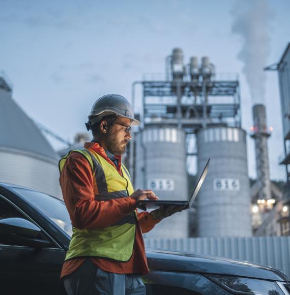 Man in front of power station