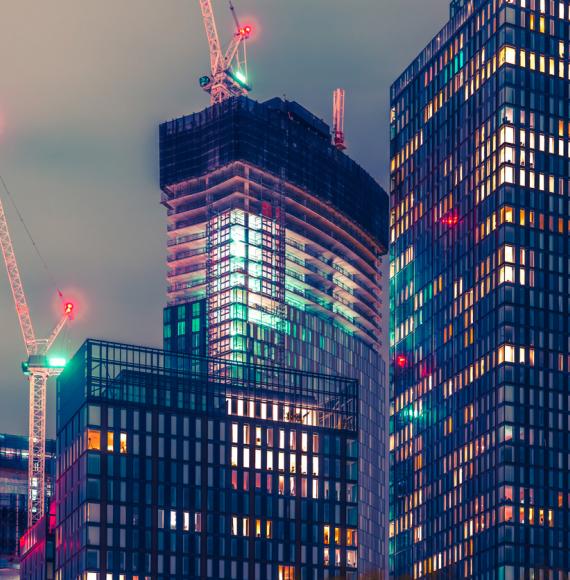 Tall buildings at night in Manchester