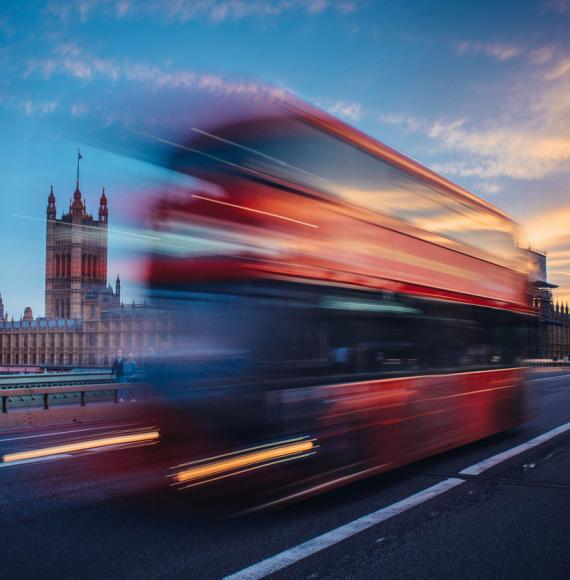 bus crossing westminster bridge in london