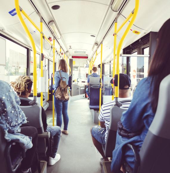 Group of people travelling on a UK bus