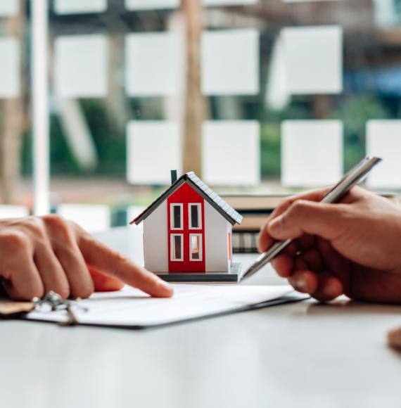 Two people signing a tenancy agreement