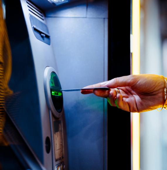 Woman taking cash out of an ATM