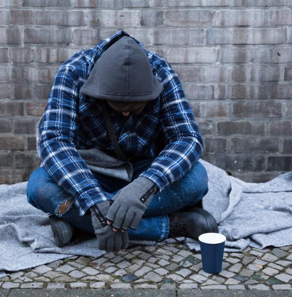 Beggar Sitting On Street stock photo