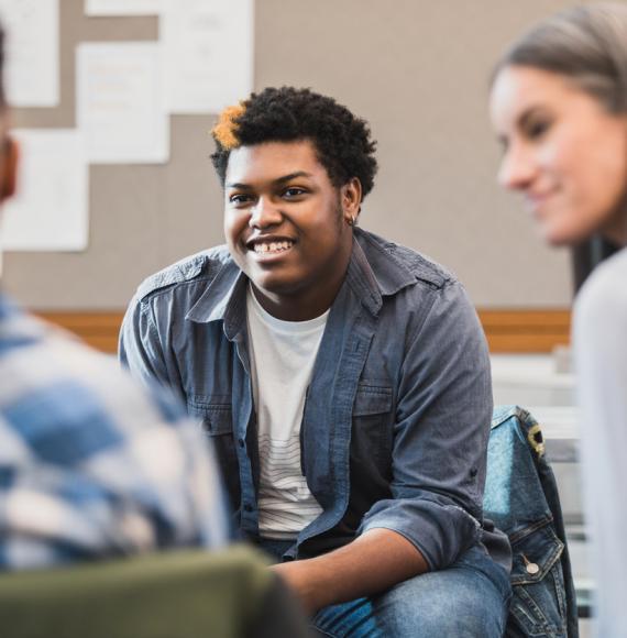 Young person talking to adults