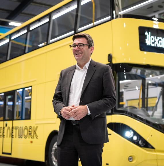Andy Burnham with one of the buses