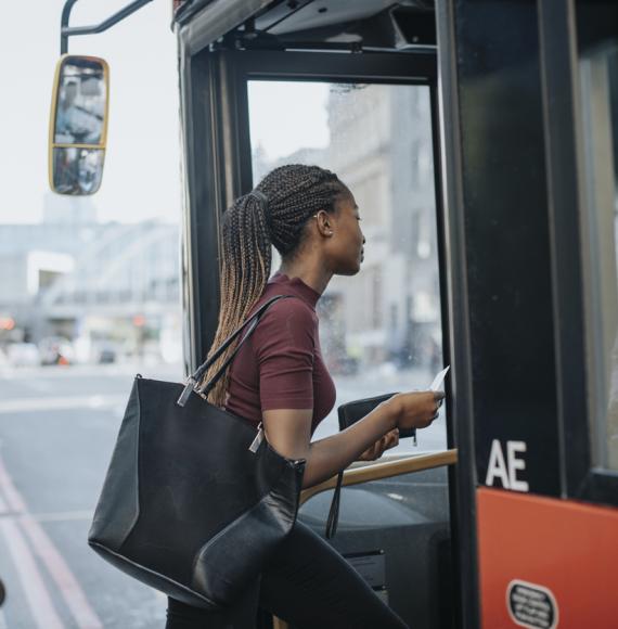 Woman getting onto a bus