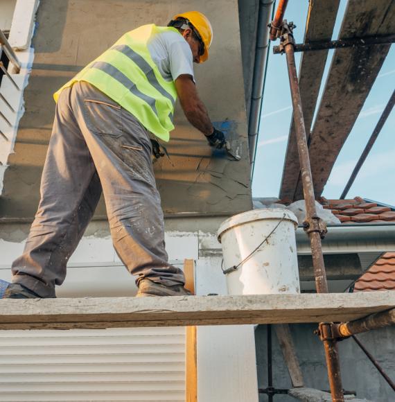 Man building an affordable house in West Sussex