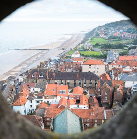 Aerial view of a town in North Norfolk through a stone window