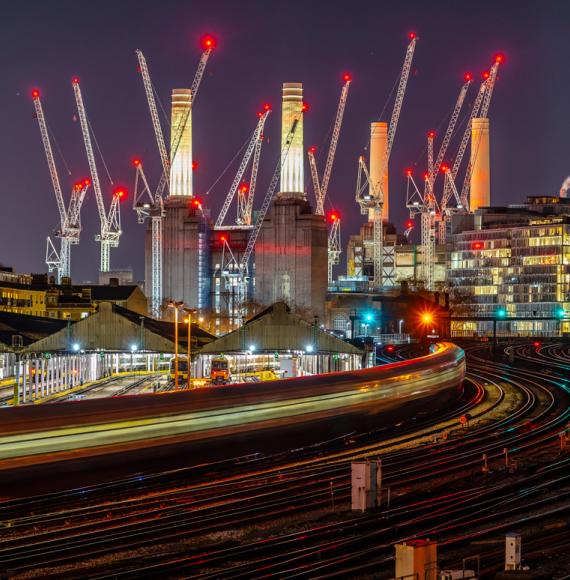 Battersea power station and rail links at night