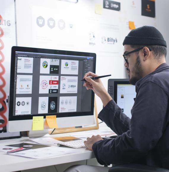 Man using a computer to create something