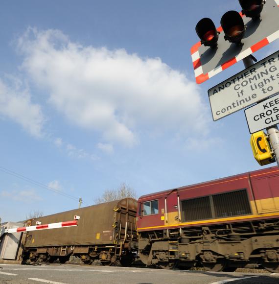 Freight train going through a level crossing