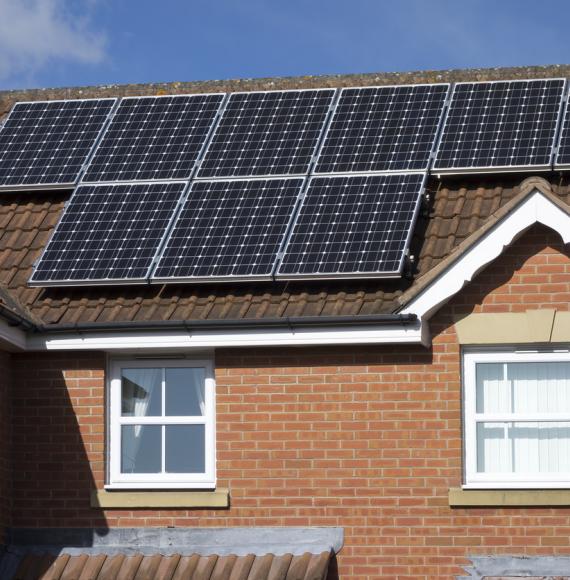 House with solar panels on the top