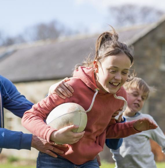 Kids playing rugby during the summer holidays