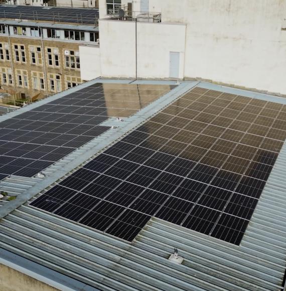 Image of some EDF solar panels on the roof of a university building