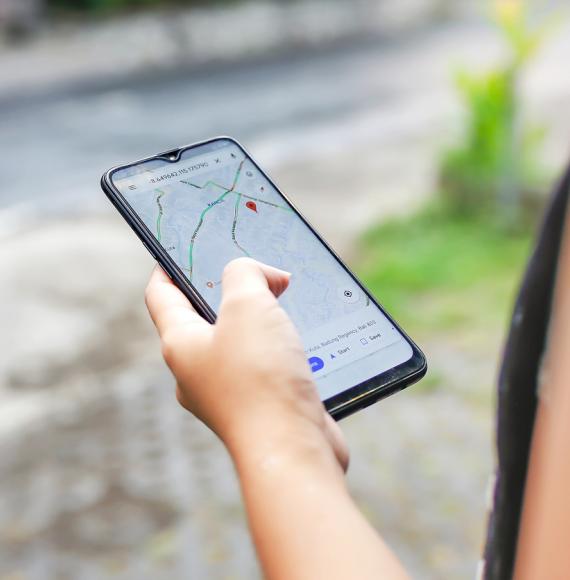 Woman using google maps to plan her journey