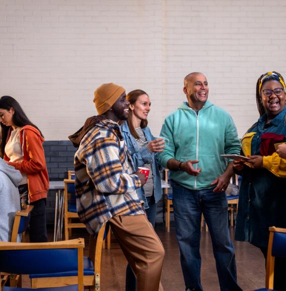 People socialising in a community centre in England