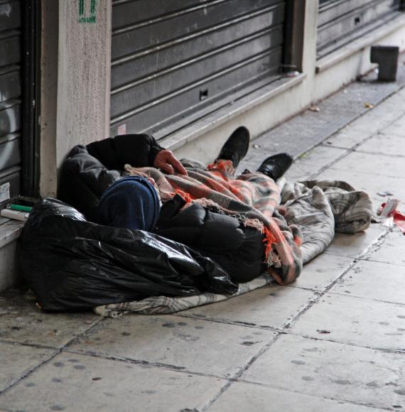 Homeless man sleeping on the street