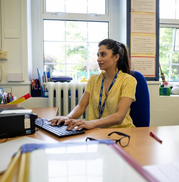 Teacher working on a computer