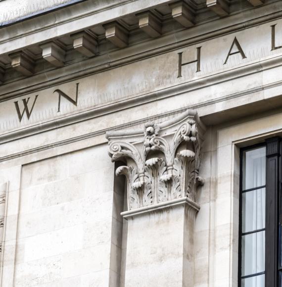 Town hall sign on exterior of local government office