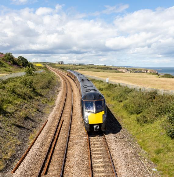 Durham Heritage Coast East Coast mainline train passing by the sea on a summer day