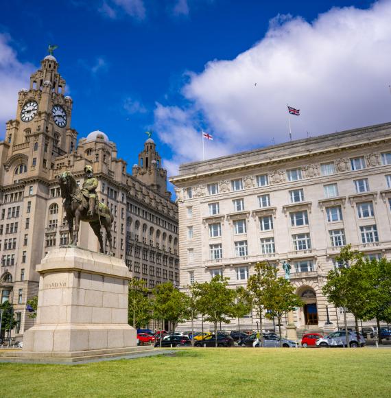 Liverpool Pier head Edward Vll Statue with Royal Liver building and Cunard building in England UK United Kingdom