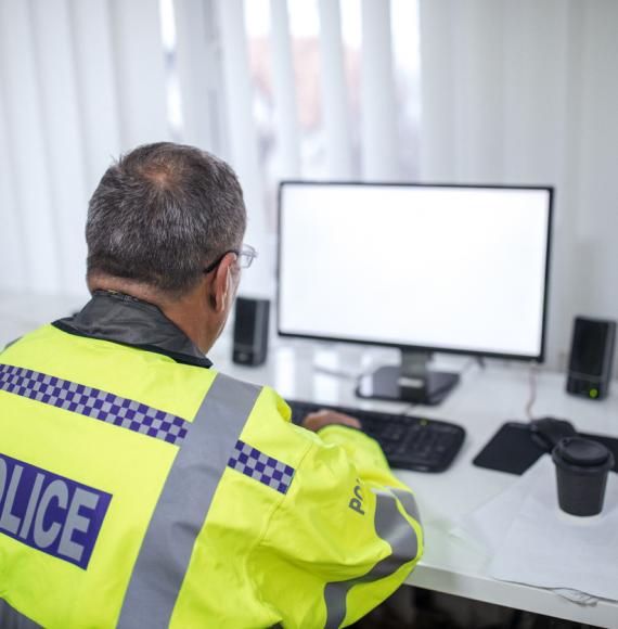 Police officer writing a report