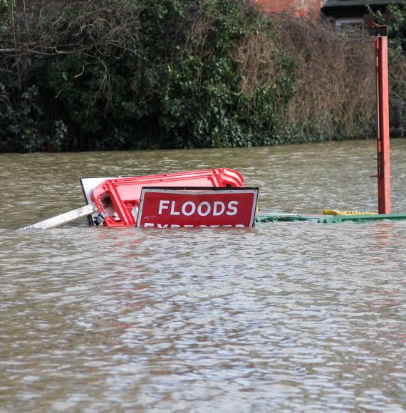 Road closed Flood signs underwater as floods have risen over them in Shrewsbury Shropshire during floods in February 2020