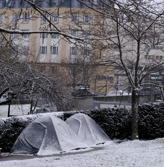 Tents of homeless people as seen in park during a heavy snowfall