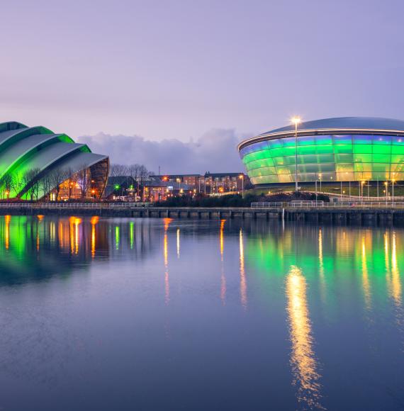 The Scottish Exhibition and Conference Centre Clyde Auditorium and the Scottish Hydro Arena lit up green at night