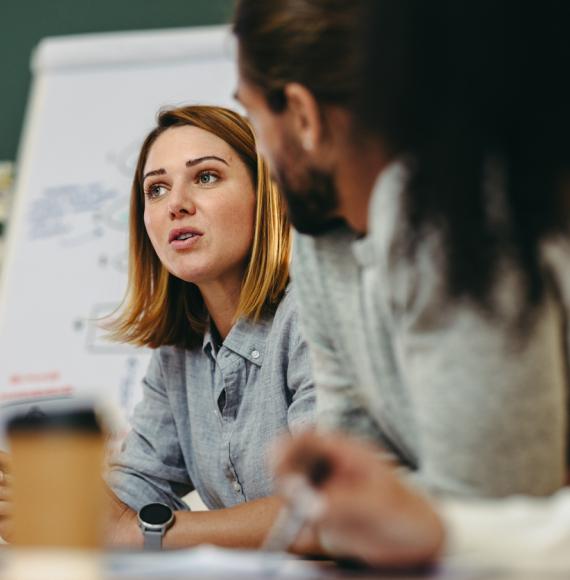 Young businesswoman having a discussion with her colleagues