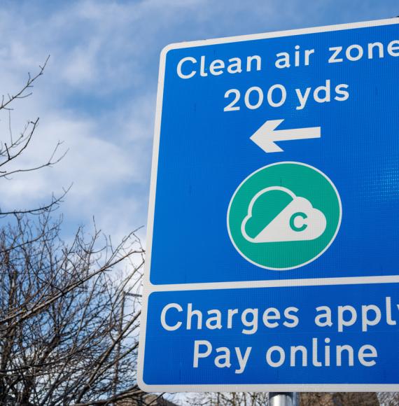 A sign indicates Clean Air Zone (CAZ) charges
