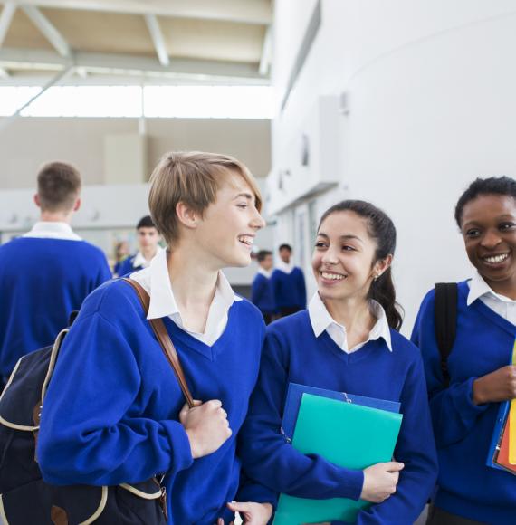Smiling female students wearing school uniforms