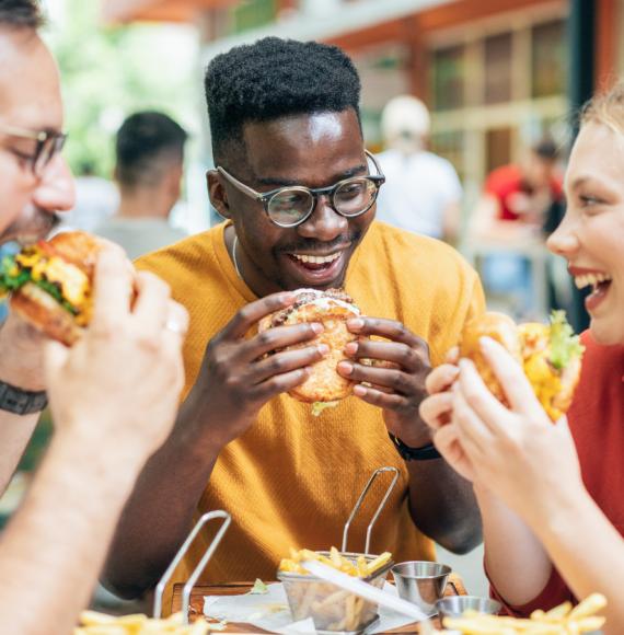 Friends eating burgers and fries