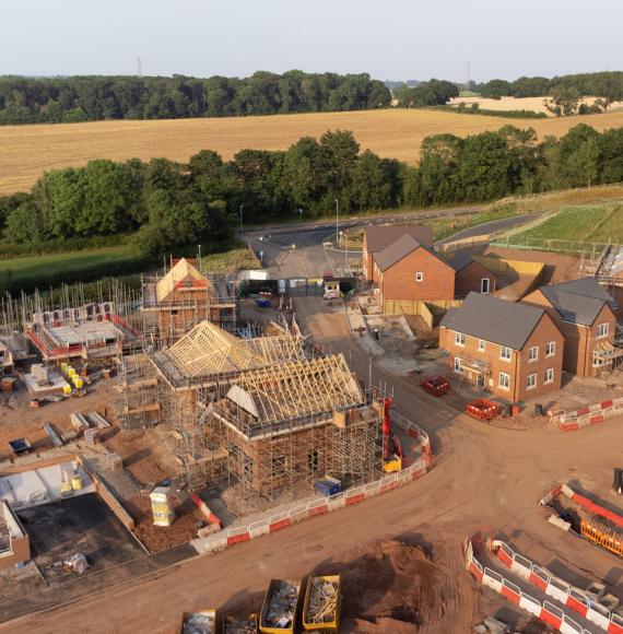 Aerial view looking down on new build housing construction site in England