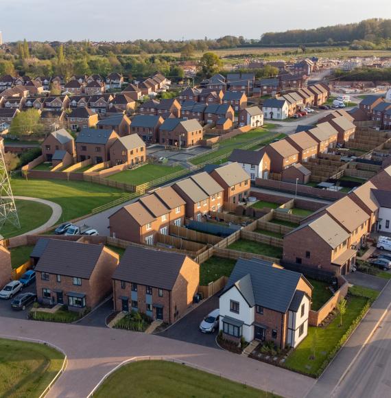 Aerial view of new build housing construction site in England