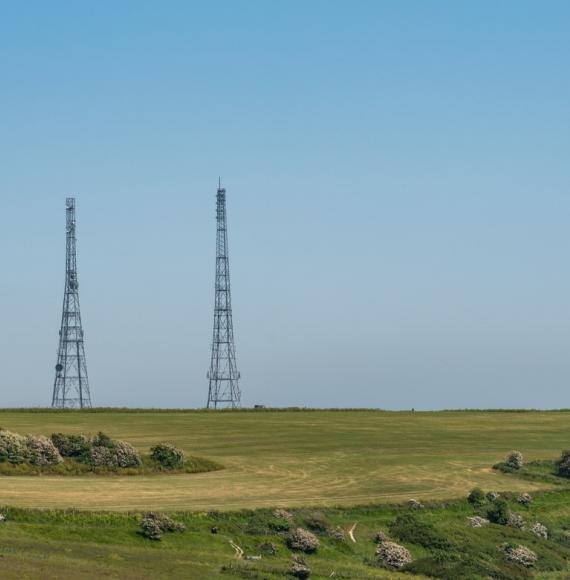 Antenna telecommunication against blue sky.