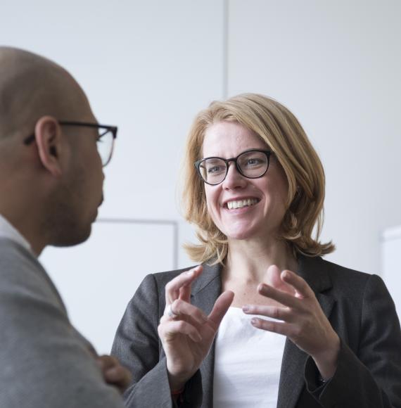 Two people, one of them a CFO, talking and discussing roles