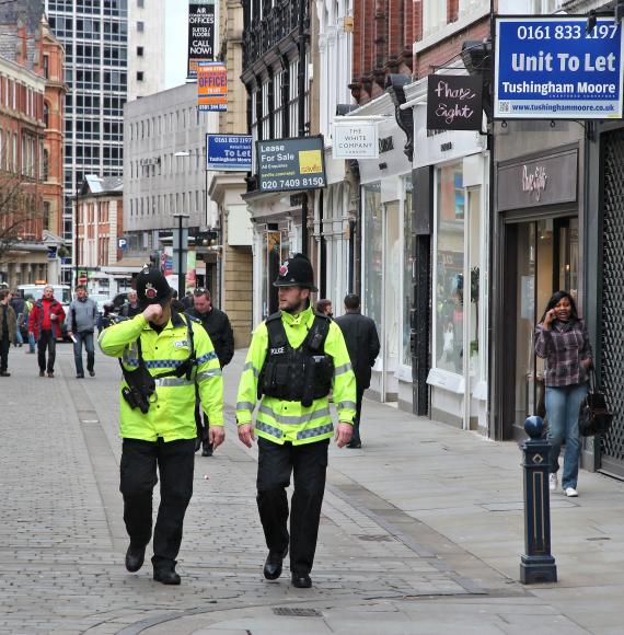 Police officers patrolling streets of Manchester, UK